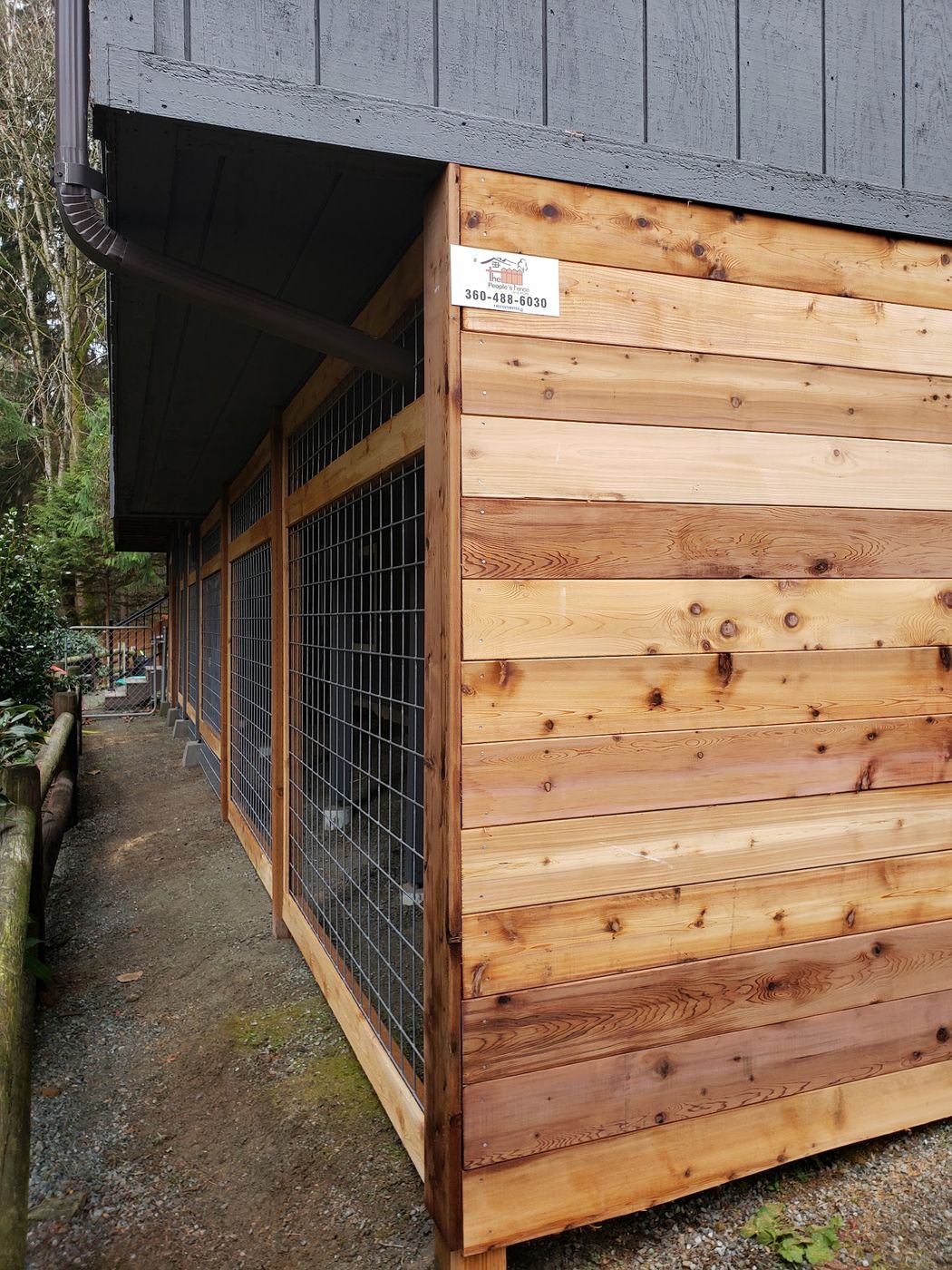 Horizontal cedar side-yard fence with wire panels